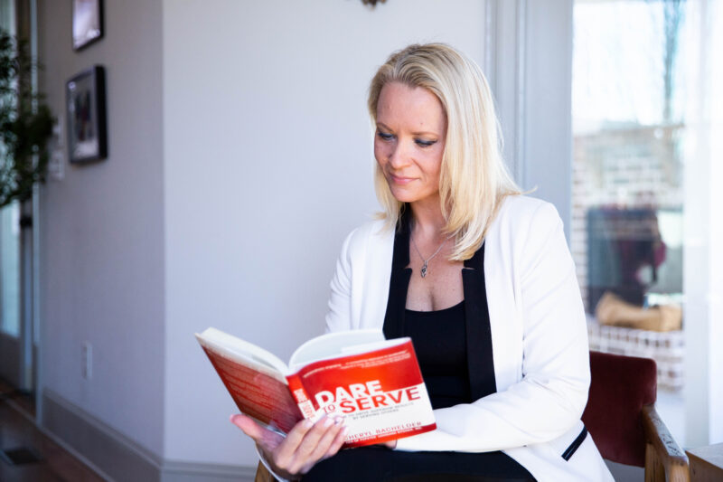 lady reading a book for professional growth purposes