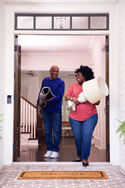 A couple decluttering their home to make more space for showings